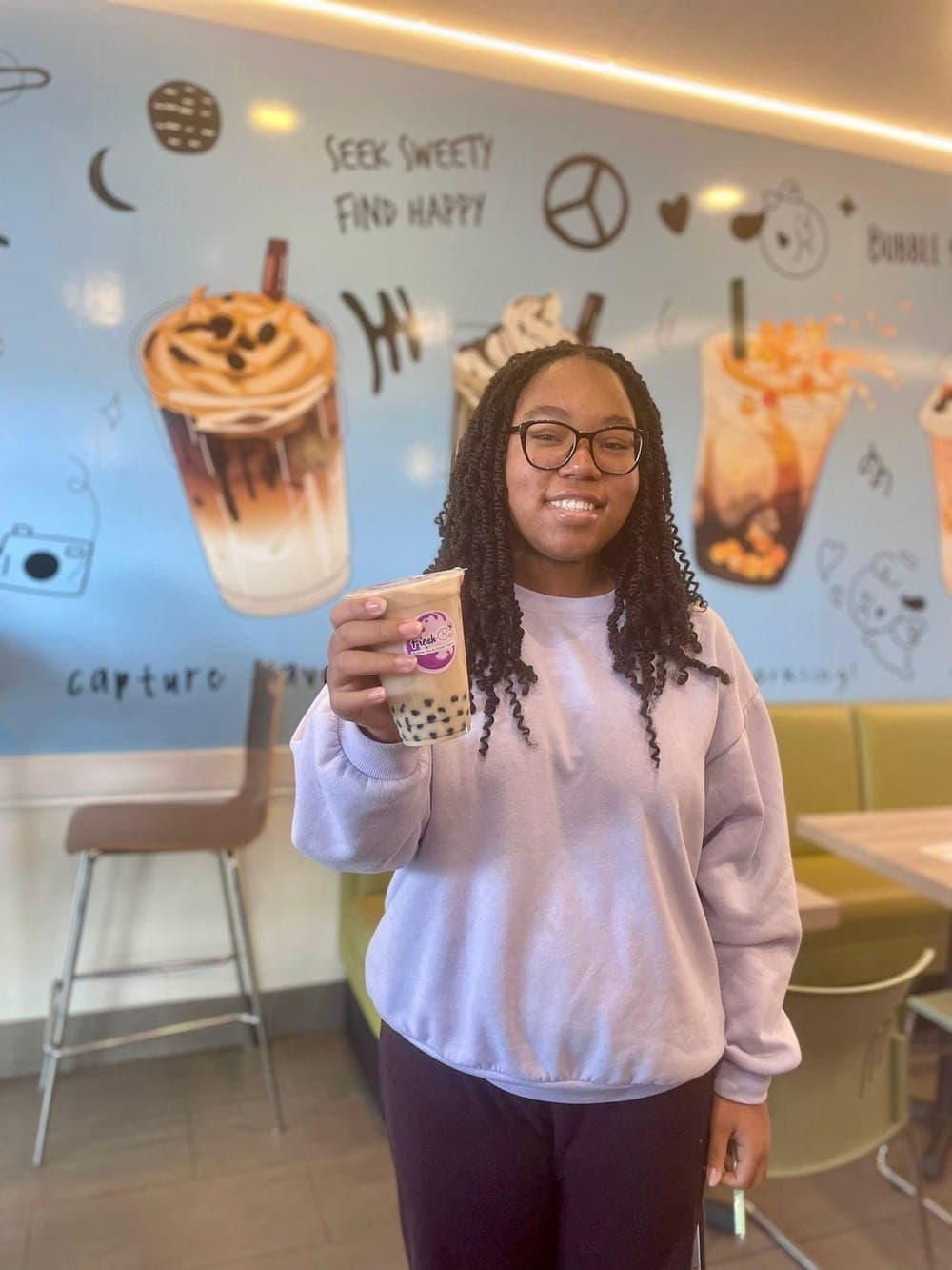 Happy Fresh Cup customer holding a boba milk tea